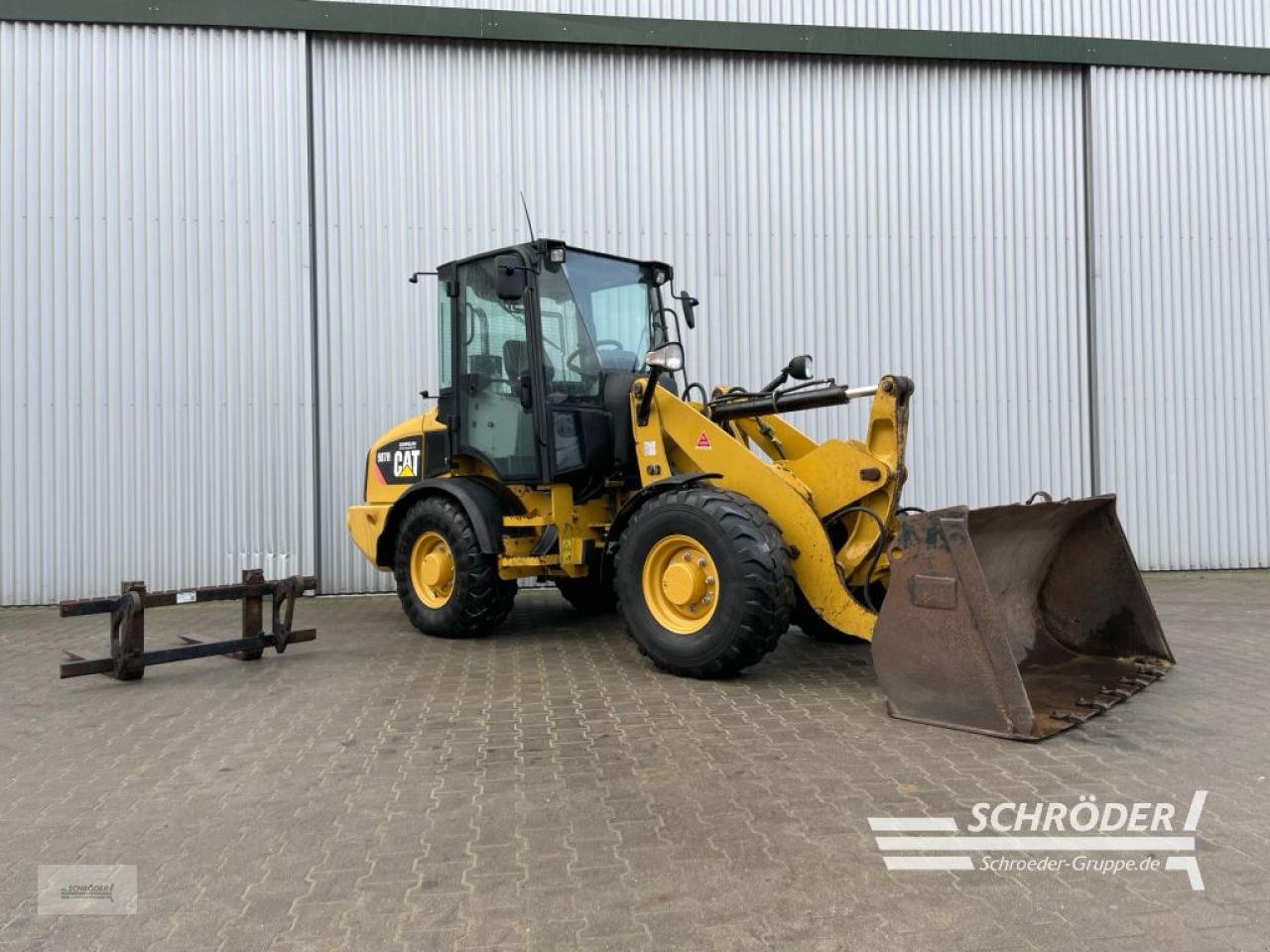 Radlader del tipo Caterpillar 907 H + SCHAUFEL + PALETTENGABEL, Gebrauchtmaschine en Wildeshausen (Imagen 1)