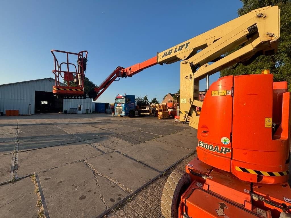 Teleskoparbeitsbühne tipa JLG E300AJP 12m knikarmhoogwerker e300 hoogwerker, Gebrauchtmaschine u Hooge mierde (Slika 11)