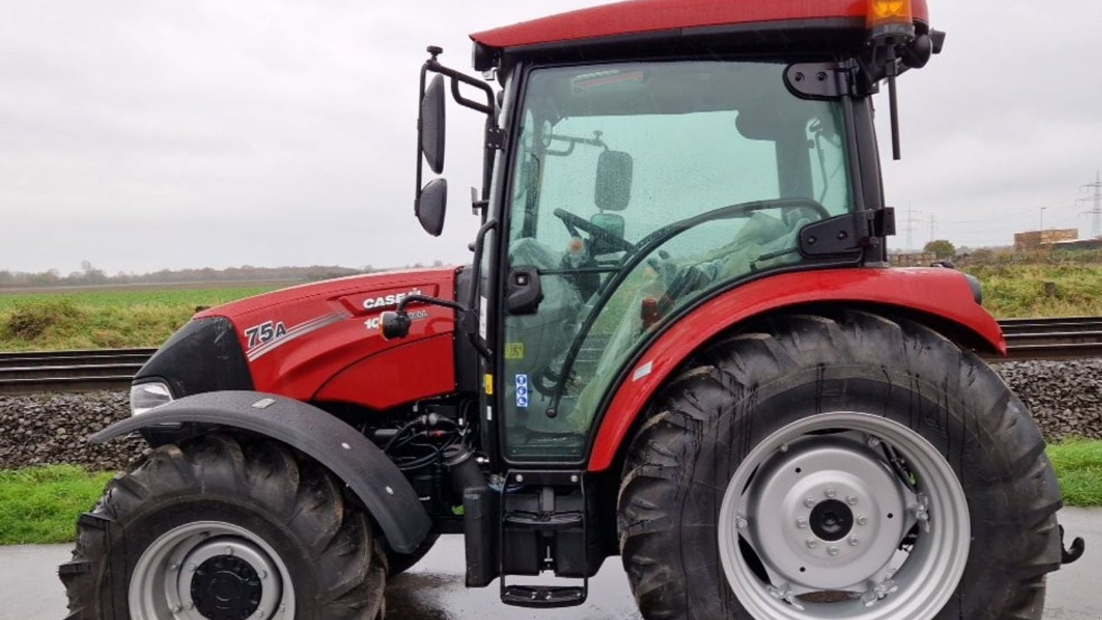 Traktor za tip Case IH Farmall 75 A Koblingsfrit vendegear og brede hjul., Gebrauchtmaschine u Lintrup (Slika 1)