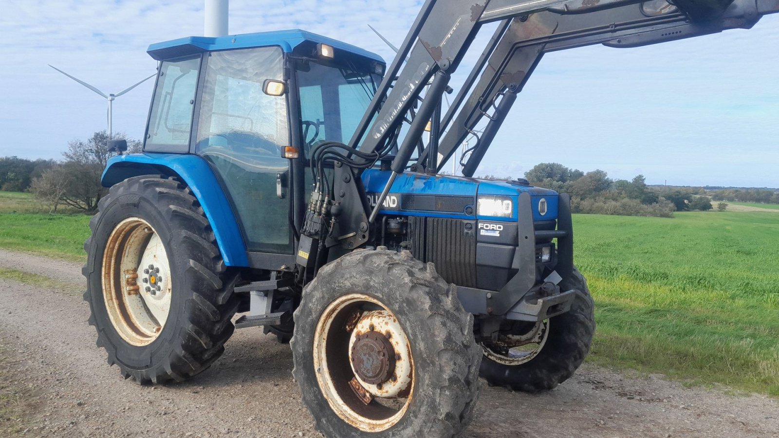 Traktor tipa New Holland 7740 SL DP med Ålø 950 frontlæsser  7740 4WD SL DP, Gebrauchtmaschine u Skive (Slika 3)