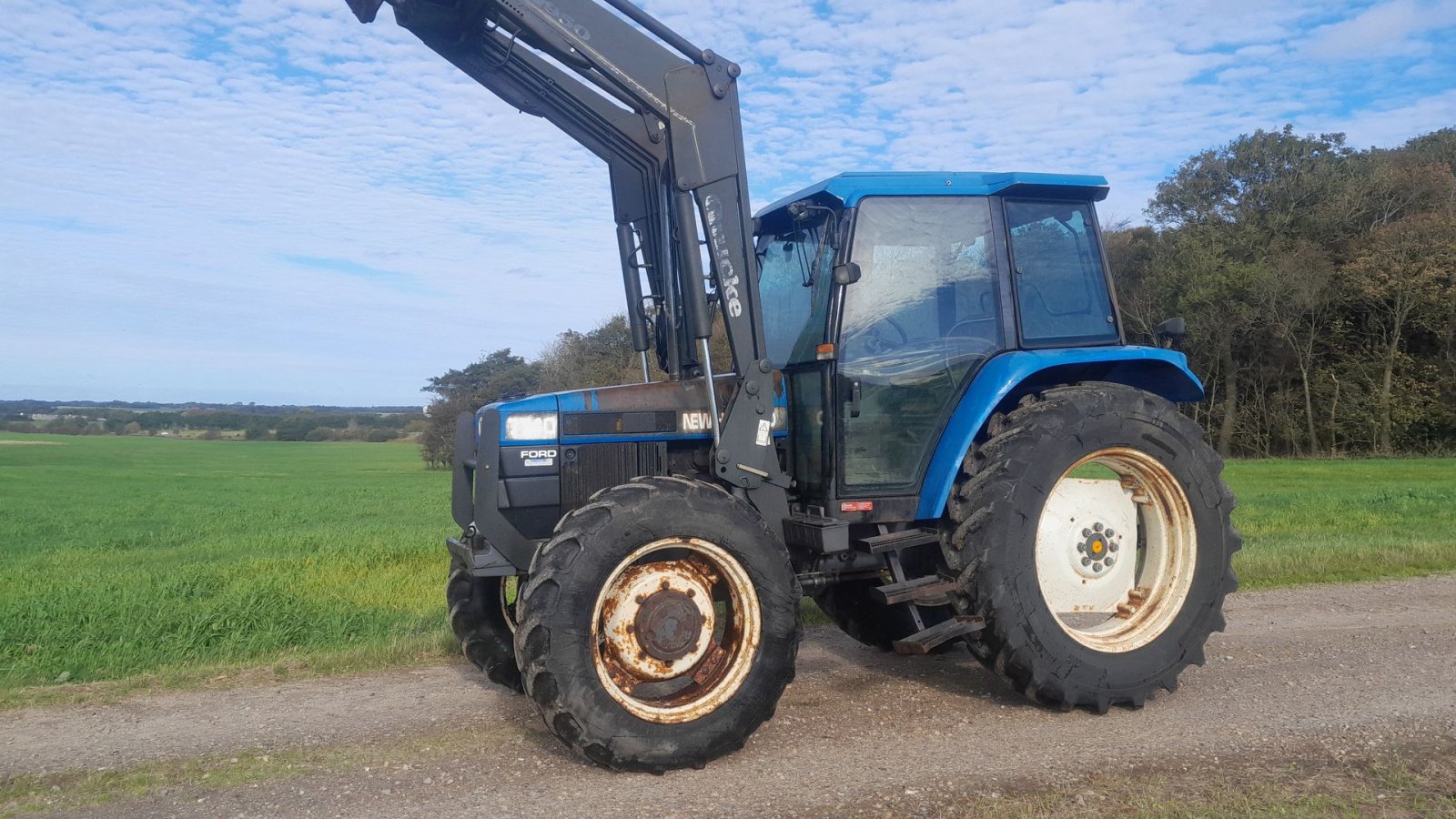 Traktor tipa New Holland 7740 SL DP med Ålø 950 frontlæsser  7740 4WD SL DP, Gebrauchtmaschine u Skive (Slika 1)