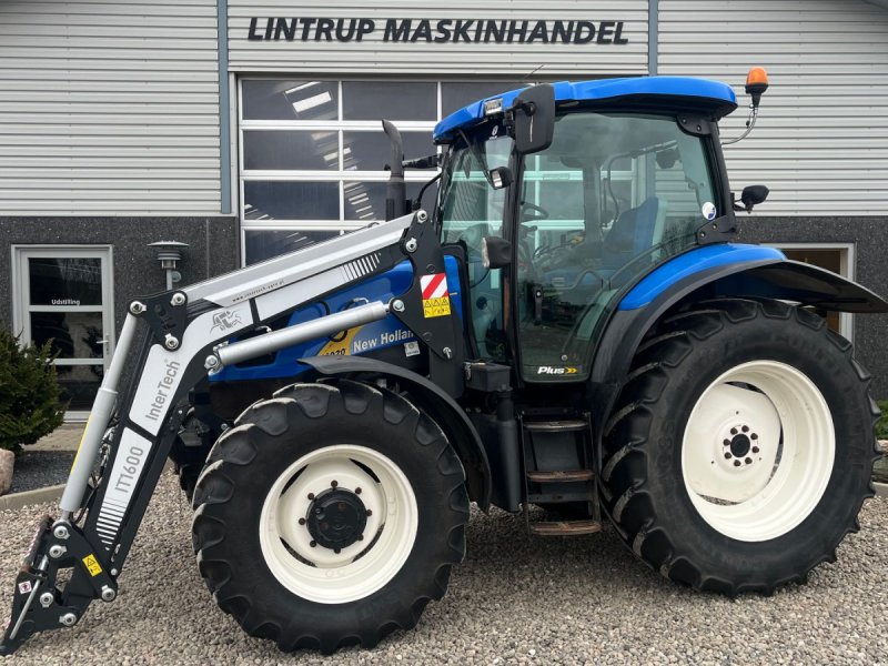 Traktor от тип New Holland T6020 Plus, med frontlæsser, Gebrauchtmaschine в Lintrup (Снимка 1)